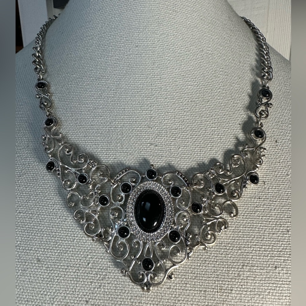 Silvertone scrollwork necklace with black bead accents